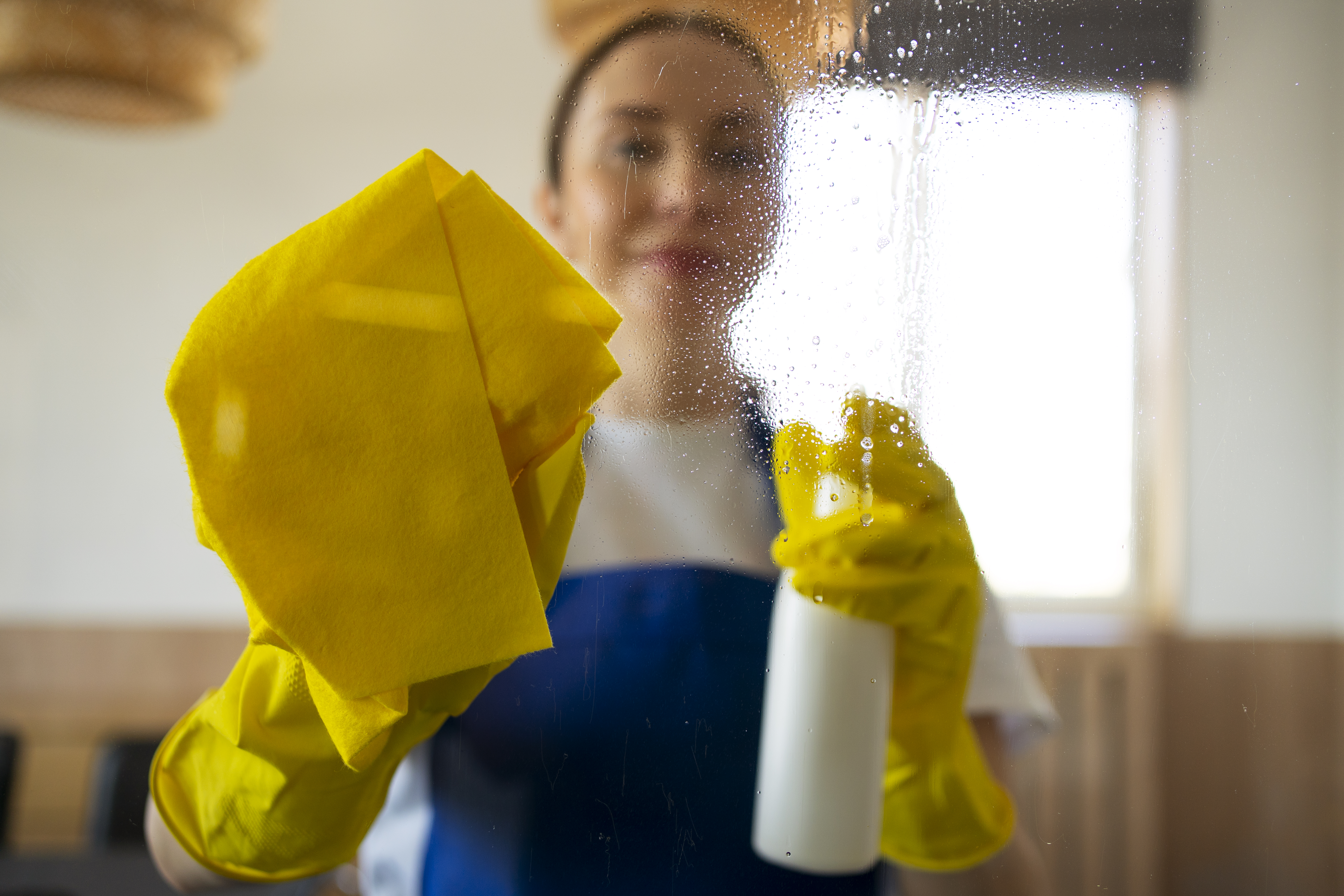 professional-cleaning-service-person-cleaning-office-window